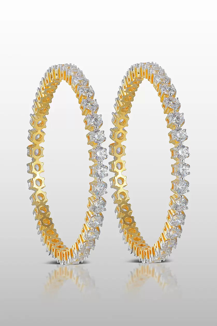 A closeup of sterling silver bangles with cubic zircons from BenzerWorld ethnicwear store.