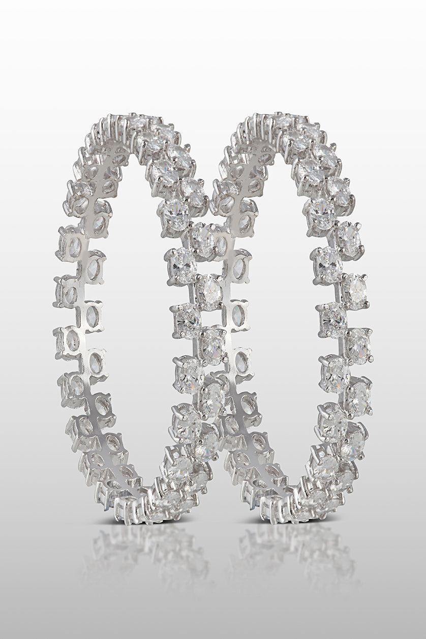 A closeup of sterling silver bangles with cubic zircon diamonds from BenzerWorld ethnicwear store.