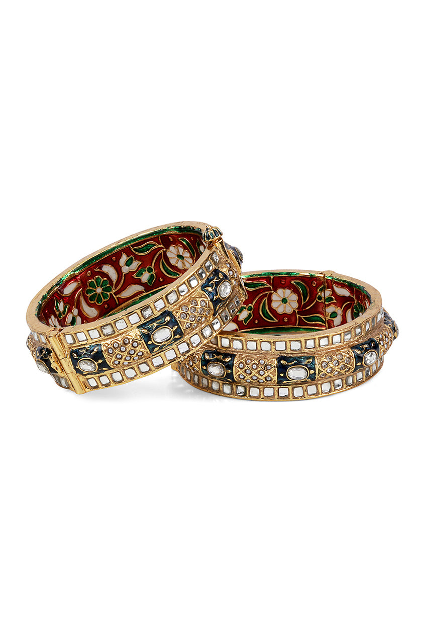 A closeup of jadau bangles with pearls from BenzerWorld ethnicwear store.