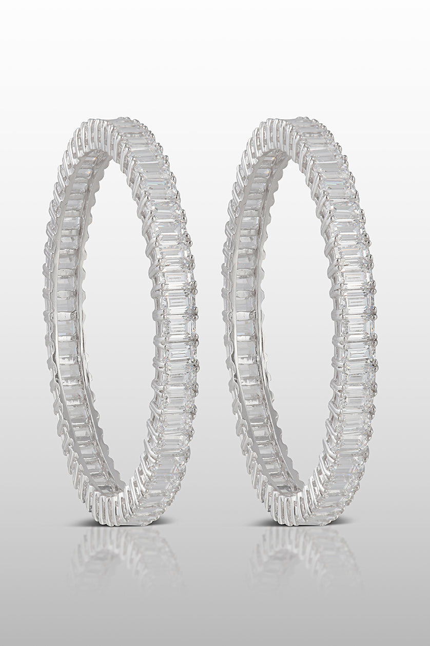 A closeup of sterling silver bangles with cubic zircon diamonds from BenzerWorld ethnicwear store.