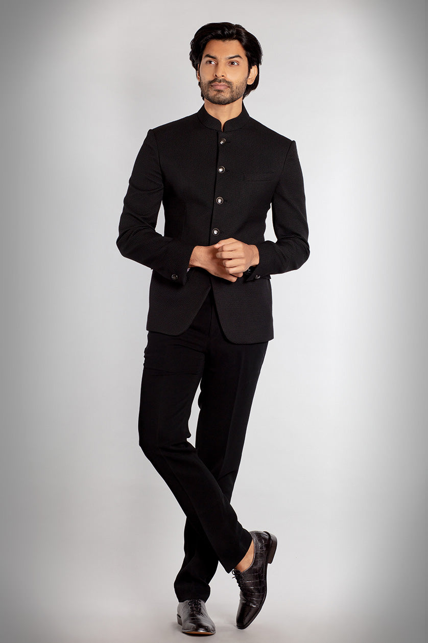 A man poses in a black jute classic bandgala from BenzerWorld ethnicwear store.
