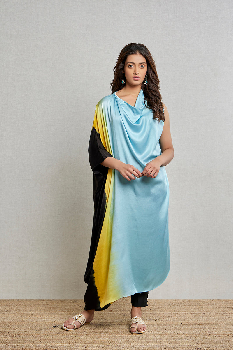 A woman poses in a blue multicoloured silk kurti from BenzerWorld ethnicwear store.