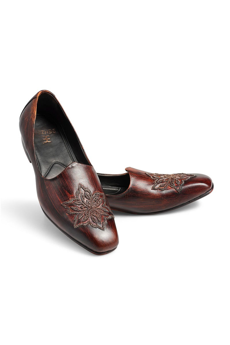 Brown leather embroidered shoes from BenzerWorld ethnicwear store with floral pattern.