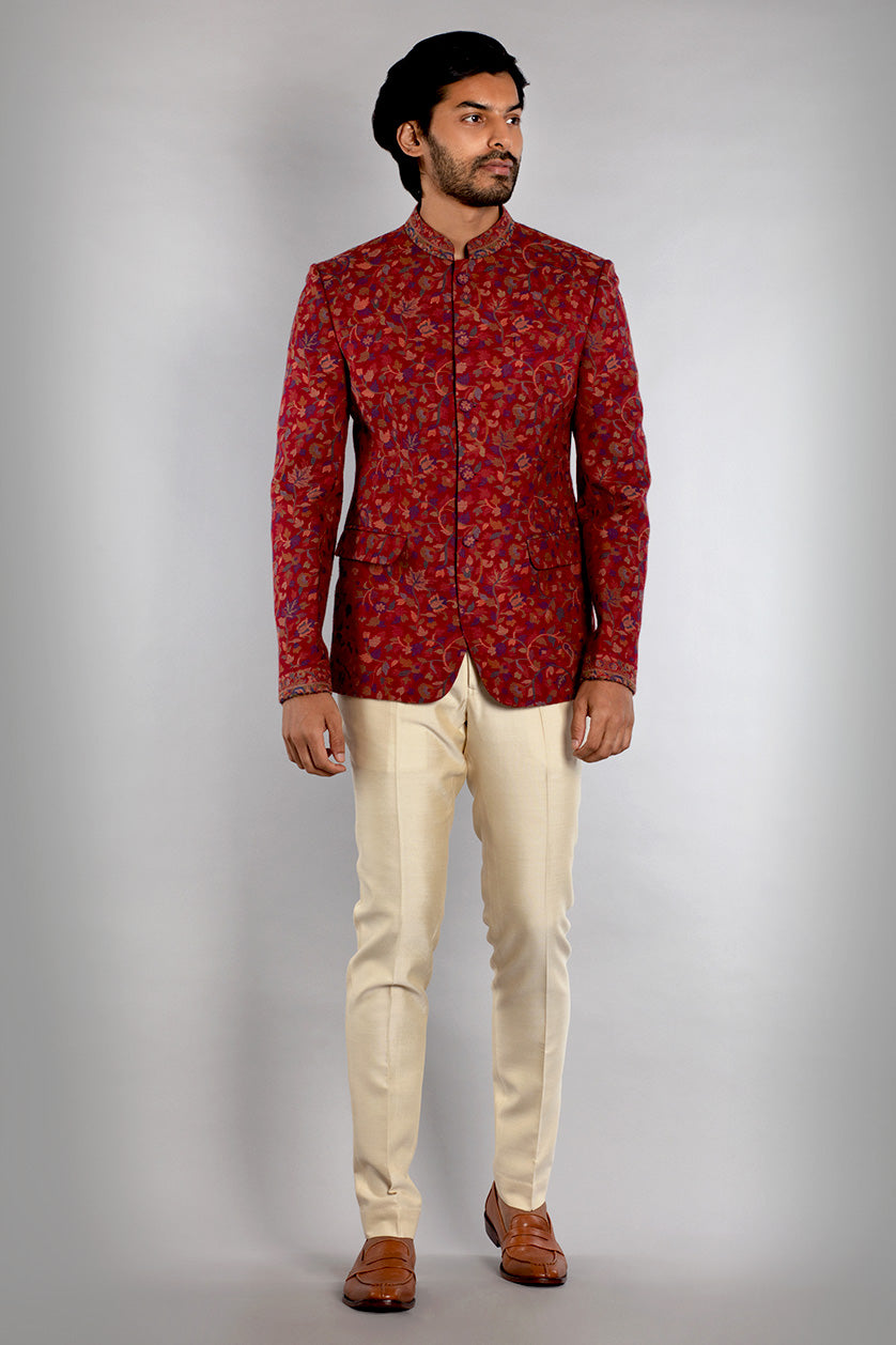 A man poses in a candy red pashmina classic bandgala from BenzerWorld ethnicwear store.