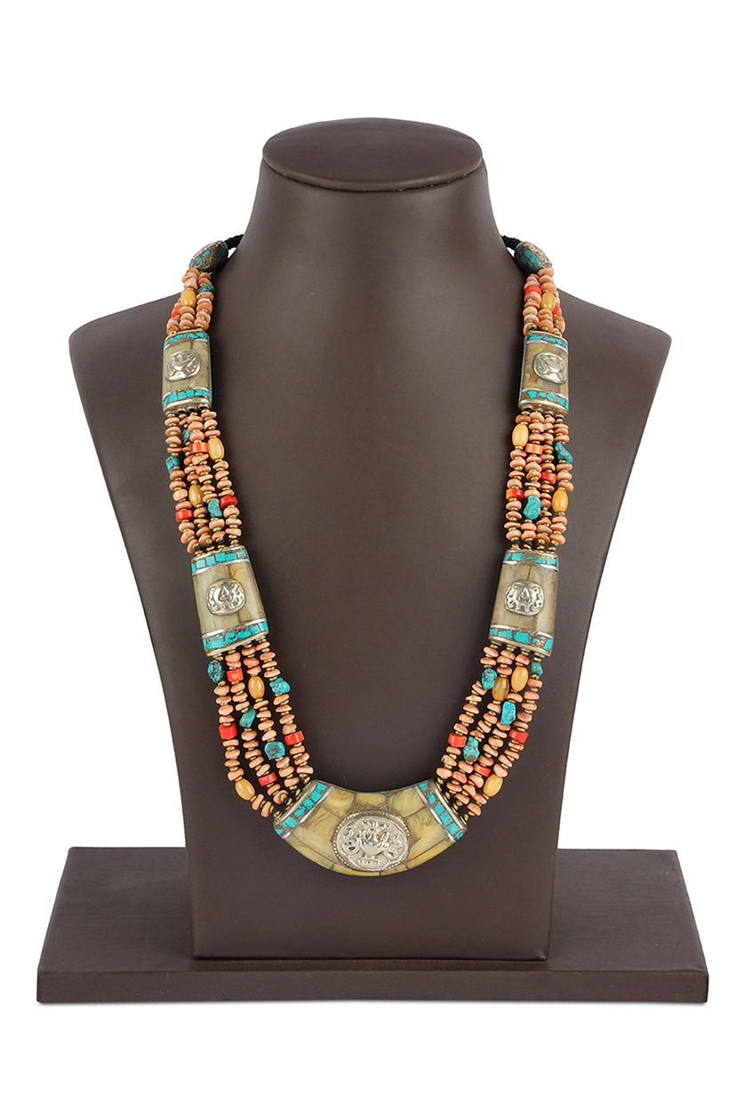 A closeup of a colourful beadednecklace with pale yellow pieces from BenzerWorld ethnicwear store.