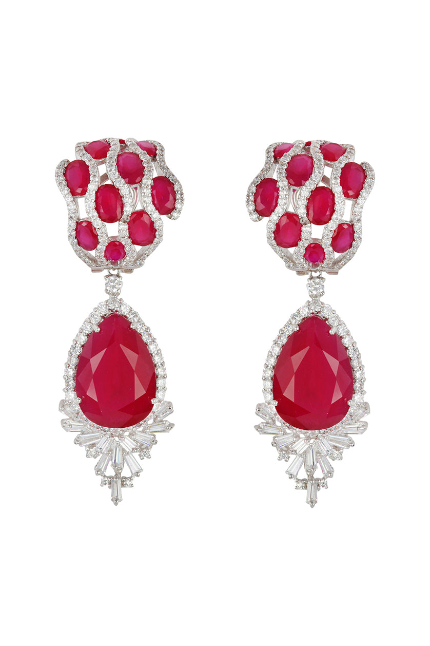 A closeup of cubic zircon earrings with semi precious stones from BenzerWorld ethnicwear store.