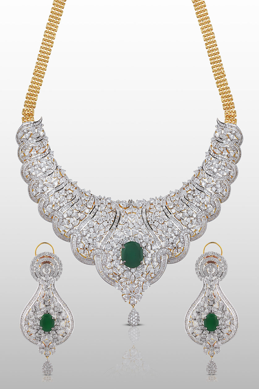 A closeup of a cubic zircon set with emerald stones from BenzerWorld ethnicwear store.