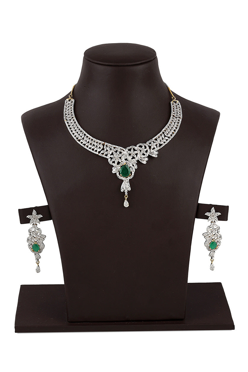 A closeup of a cubic zirconia set with green stones from BenzerWorld ethnicwear store.