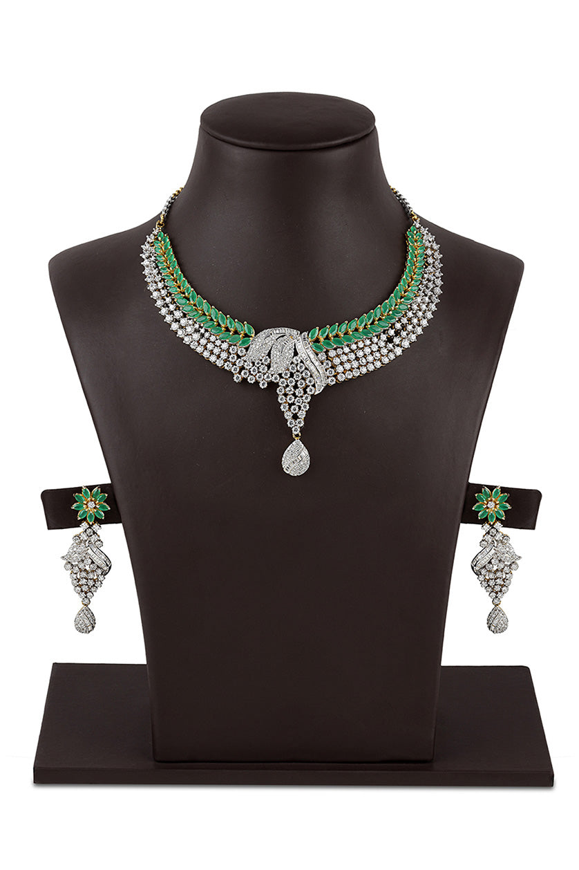 A closeup of a cubic zirconia set with green stones from BenzerWorld ethnicwear store.