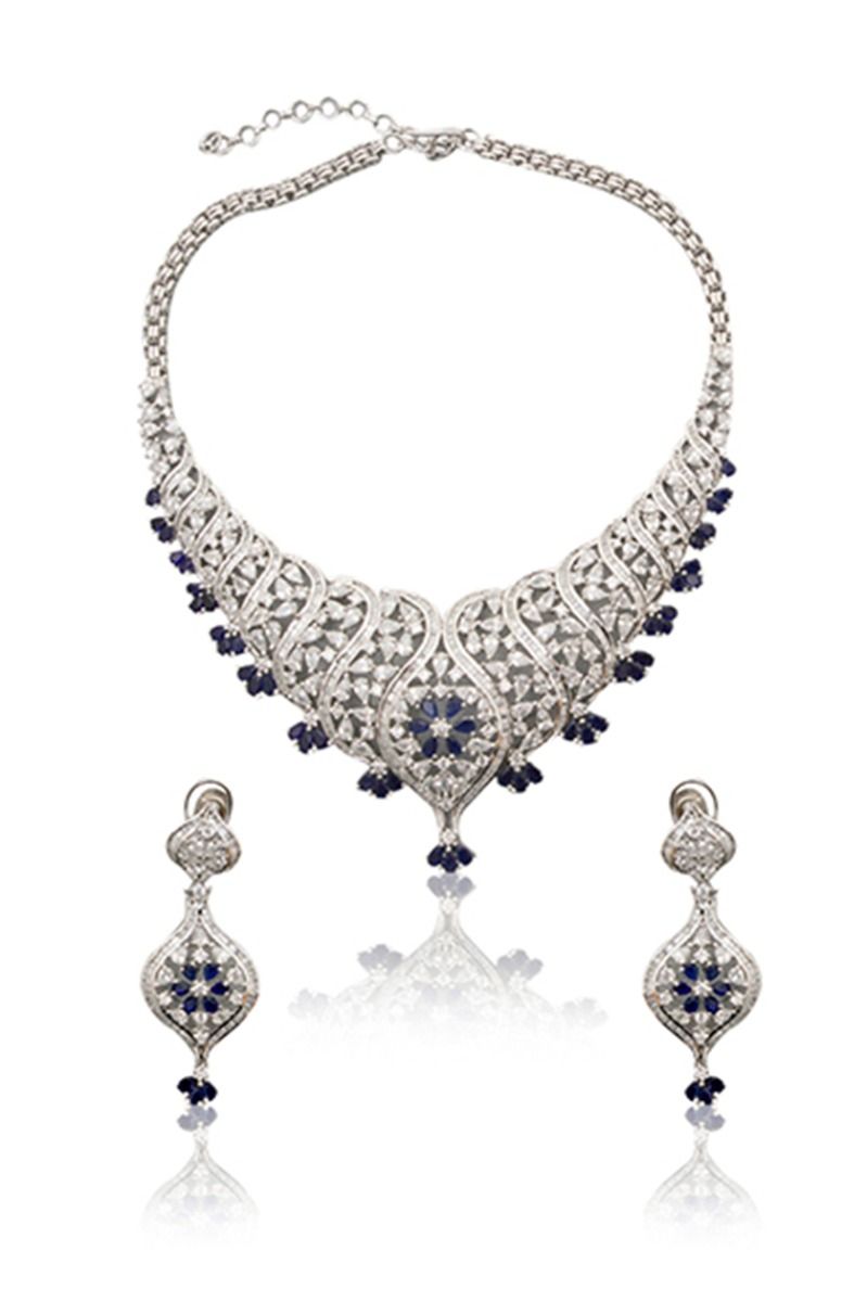 A closeup of a cubic zirconium set with blue sapphire stones from BenzerWorld ethnicwear store.