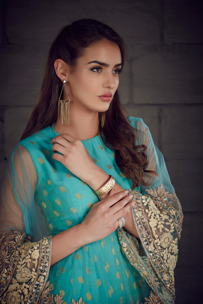 A closeup of designer earrings from BenzerWorld ethnicwear store.