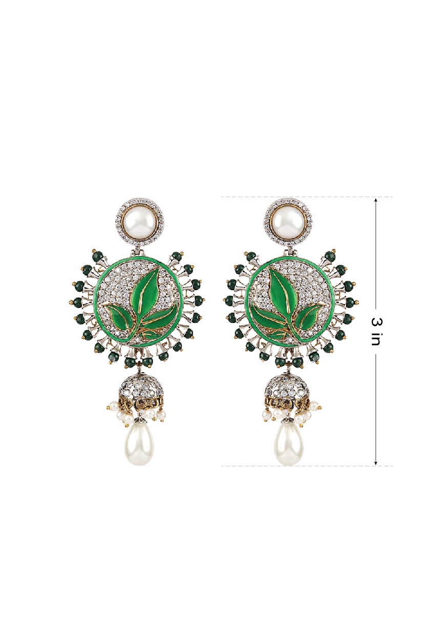 A closeup of a pair of earrings with green semi-precious stones from BenzerWorld ethnicwear store.