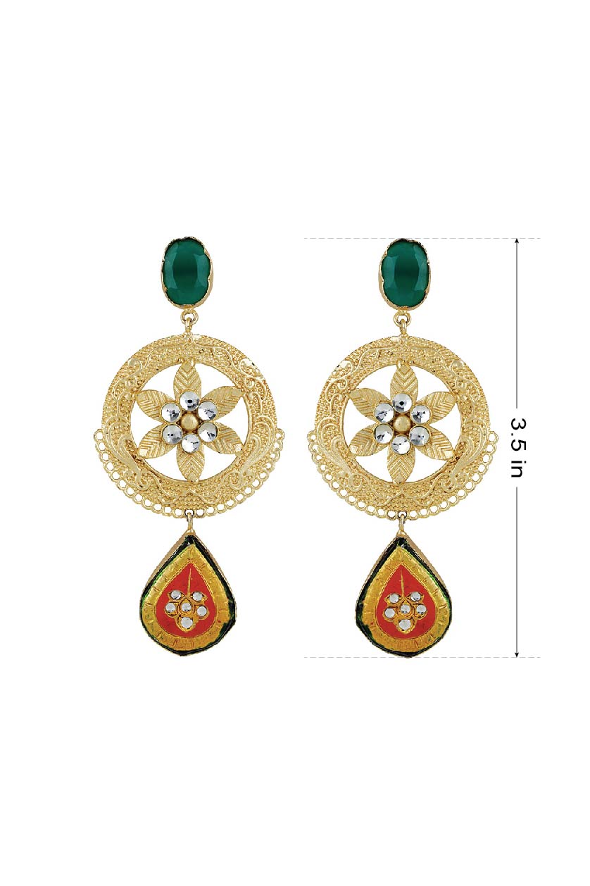 A closeup of earrings in green tops and kundans from BenzerWorld ethnicwear store.