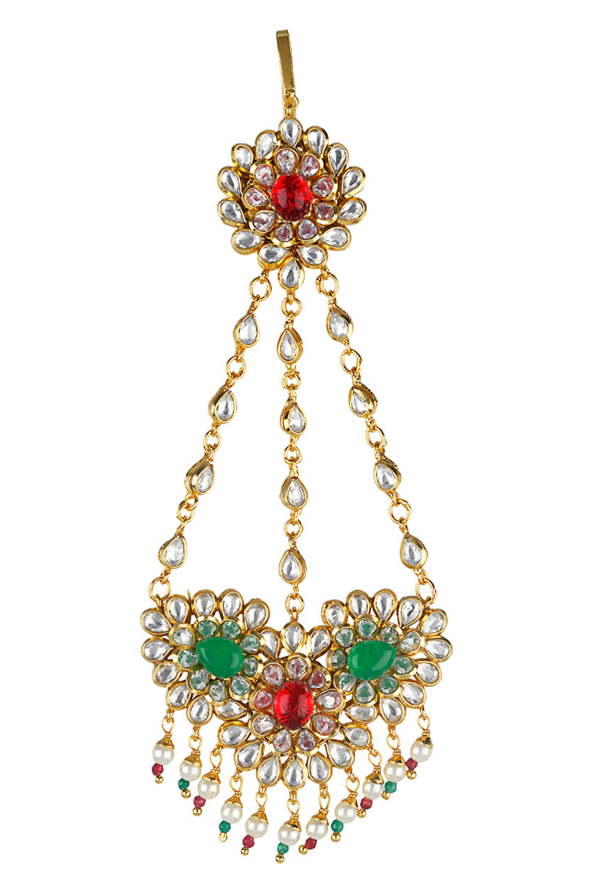 A closeup of a hair accessory with red and green stones from BenzerWorld ethnicwear store.