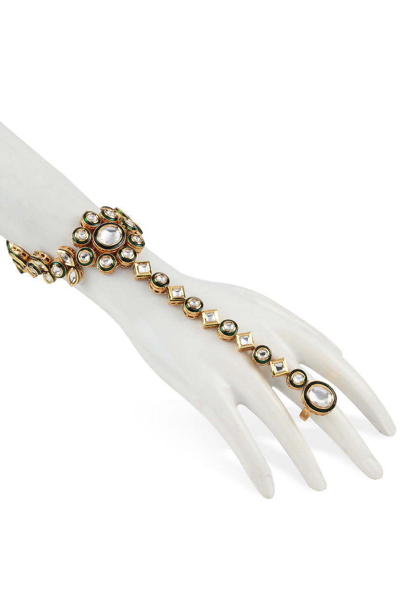 A closeup of hand chain in vilandi and green meenakari work from BenzerWorld ethnicwear store.