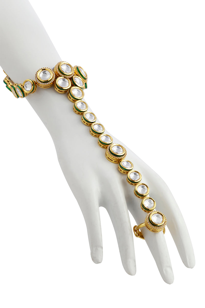 A closeup of a kundan-style single-line hand chain from BenzerWorld ethnicwear store.