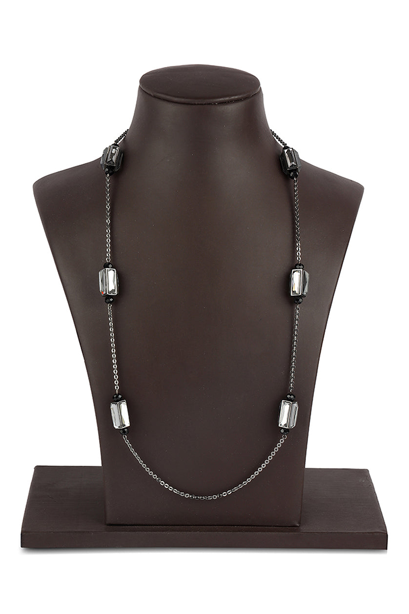 A closeup of a long necklace with mirrored crystals from BenzerWorld ethnicwear store.