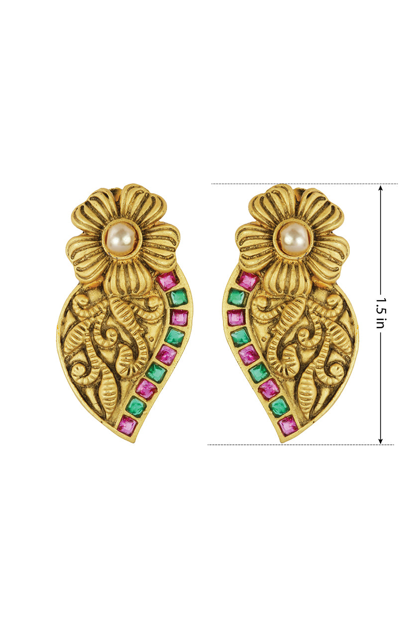 A closeup of matte gold antique earrings from BenzerWorld ethnicwear store.