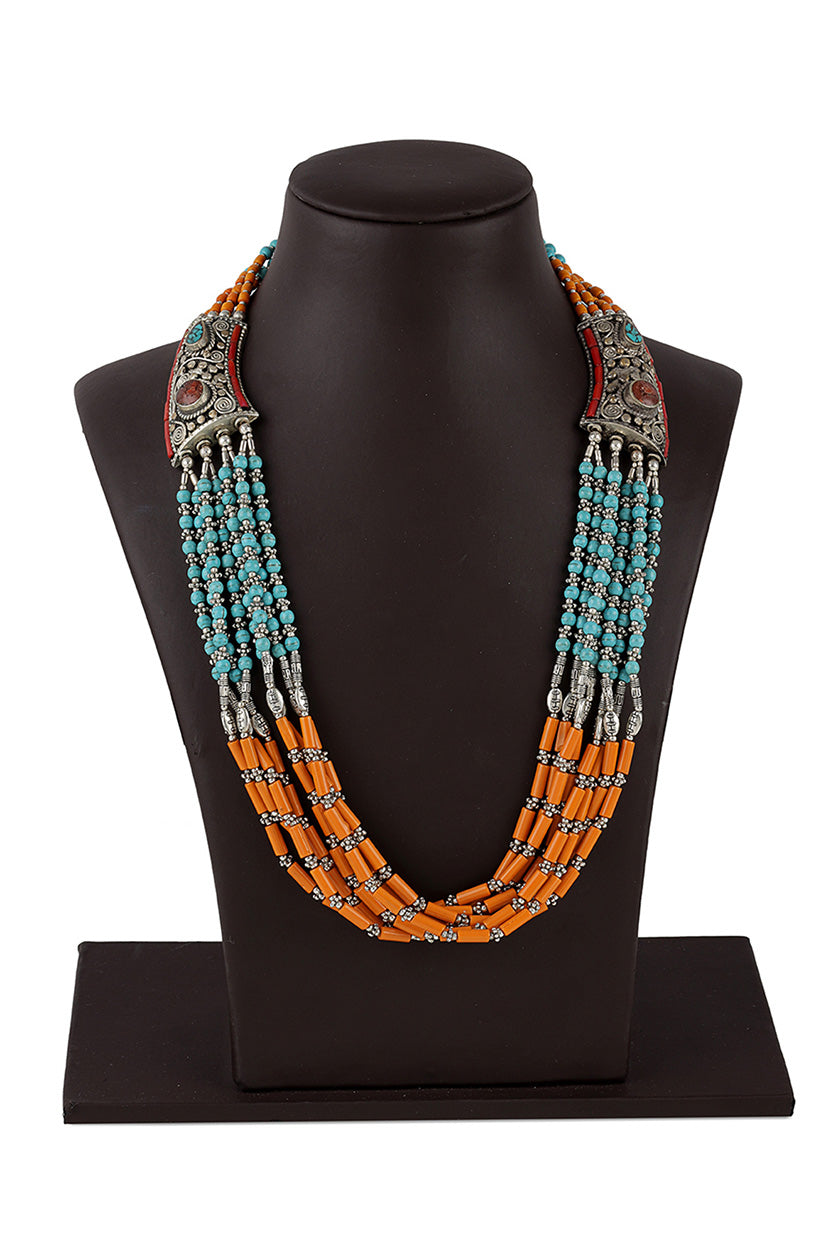 A closeup of a copper-based multicoloured necklace from BenzerWorld ethnicwear store.