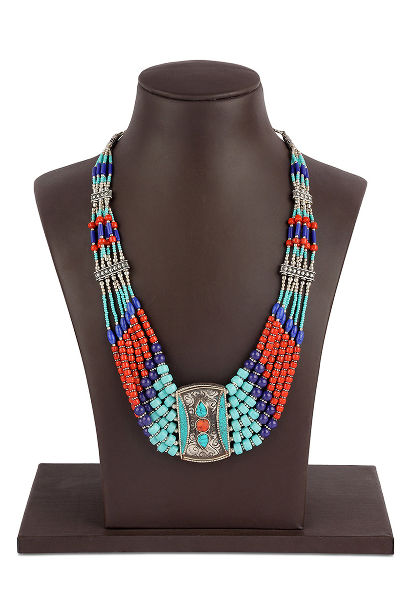 A closeup of a multicoloured tribal necklace from BenzerWorld ethnicwear store.
