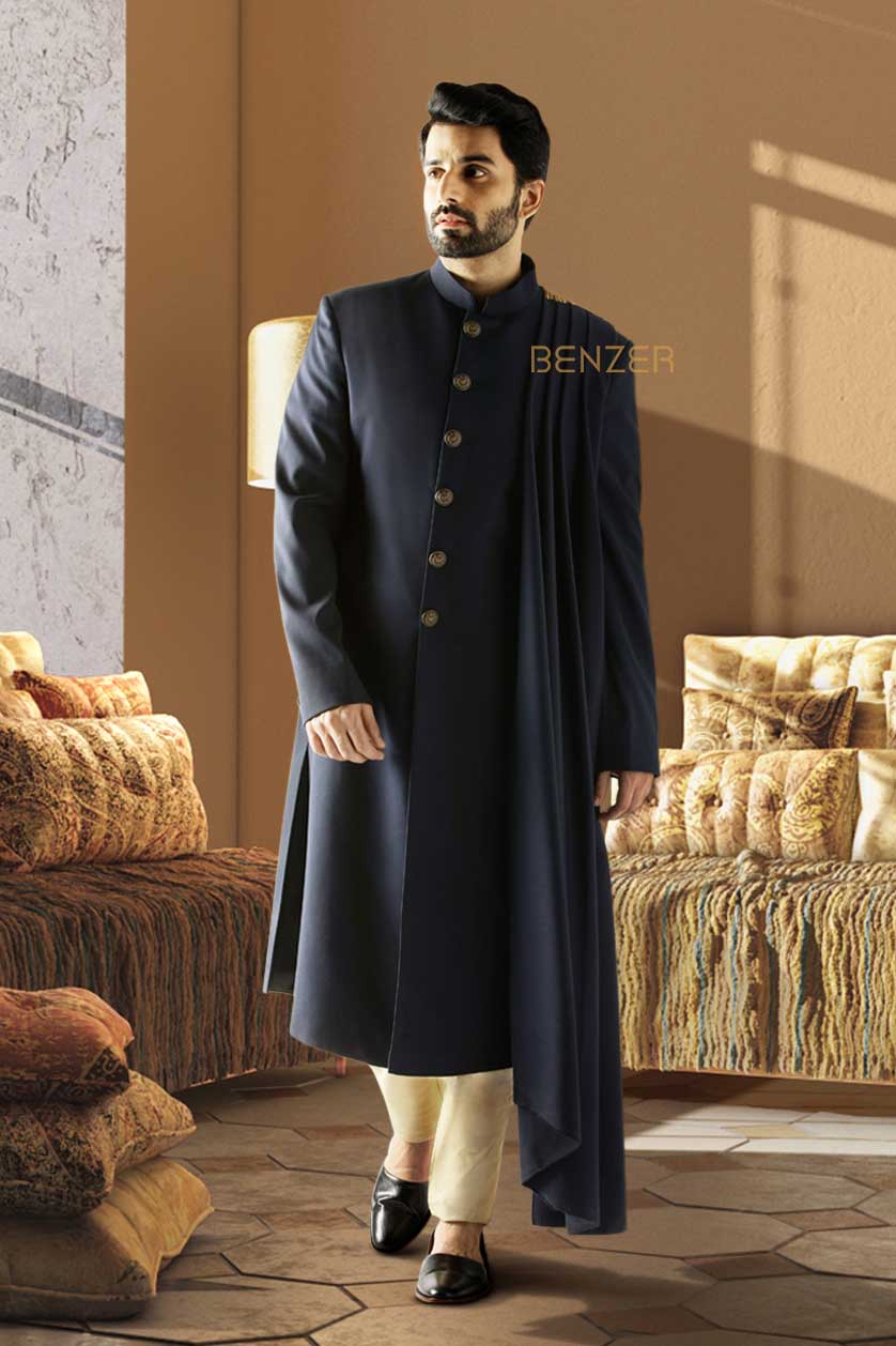 A man poses in a navy blue terrywool cocktail outfit from BenzerWorld ethnicwear store.