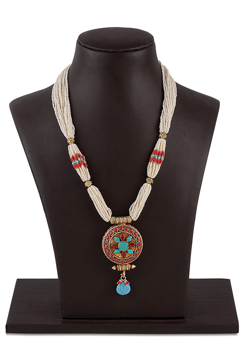 A closeup of a necklace in circular pendant from BenzerWorld ethnicwear store.