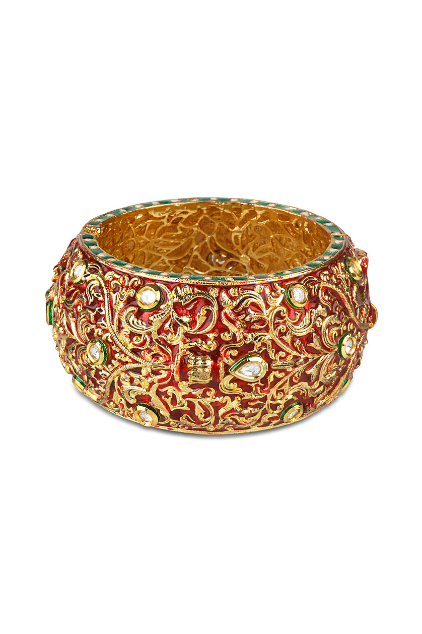A closeup of red meenakari work kada from BenzerWorld ethnicwear store.