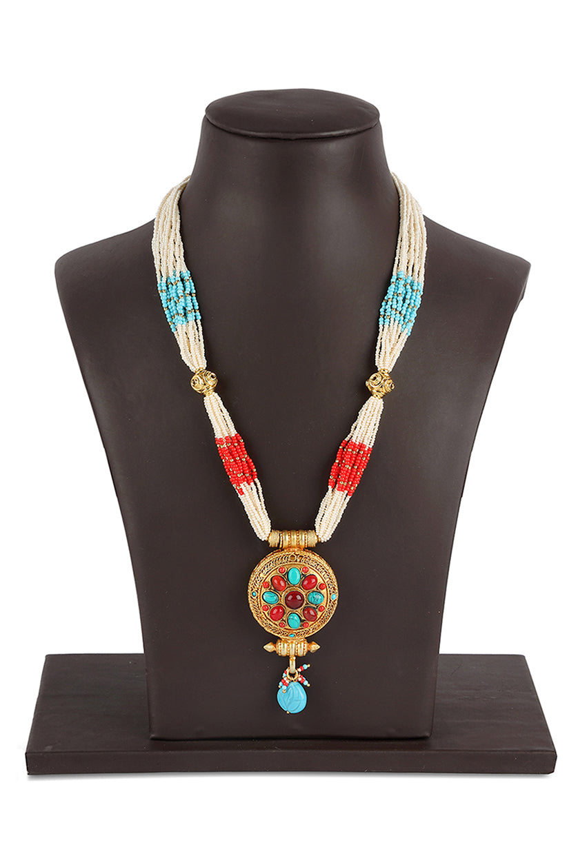 A closeup of a round locket pendant with fine beads from BenzerWorld ethnicwear store.