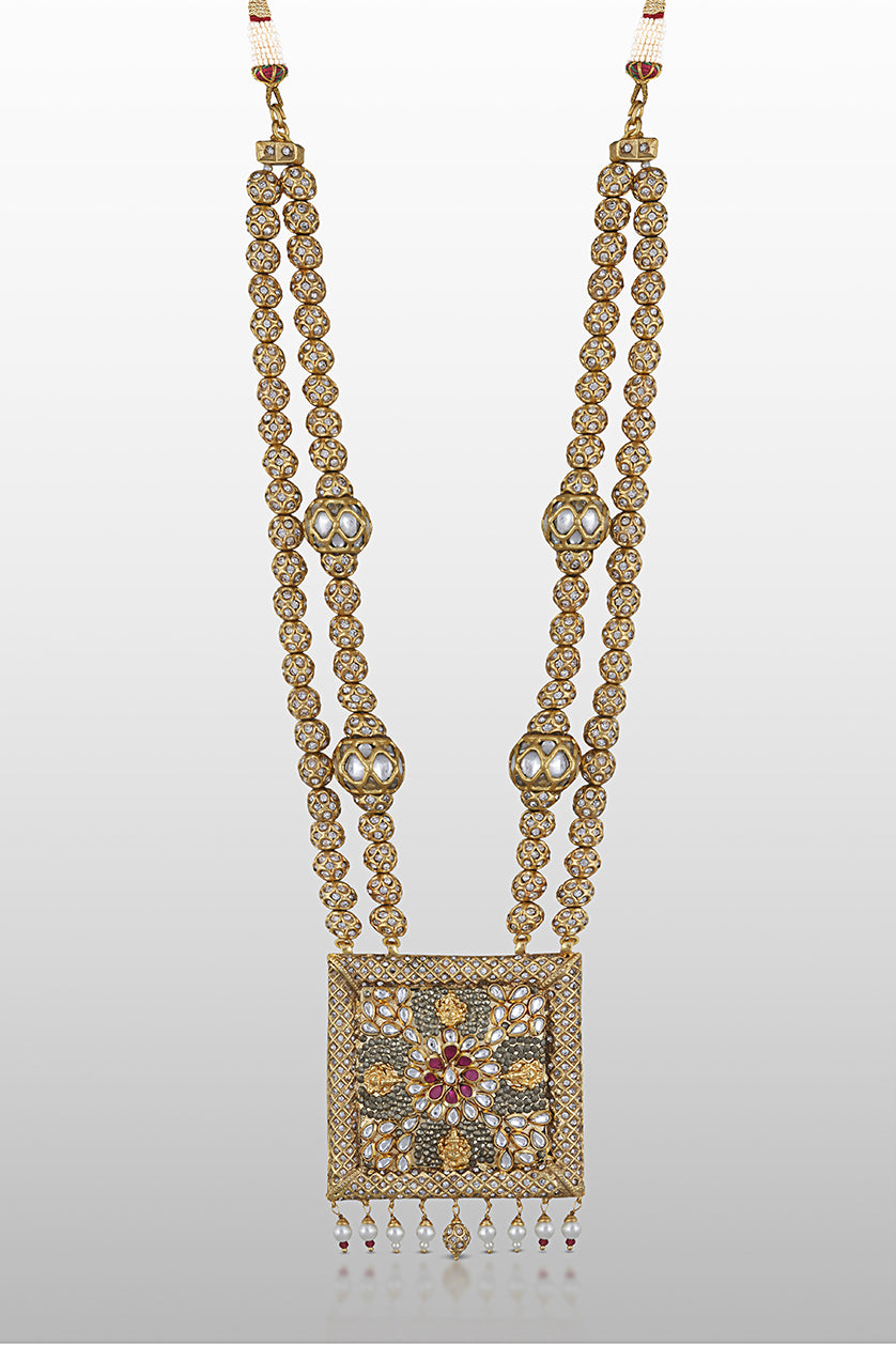 A closeup of silver necklace with pearlin n markastine work from BenzerWorld ethnicwear store.