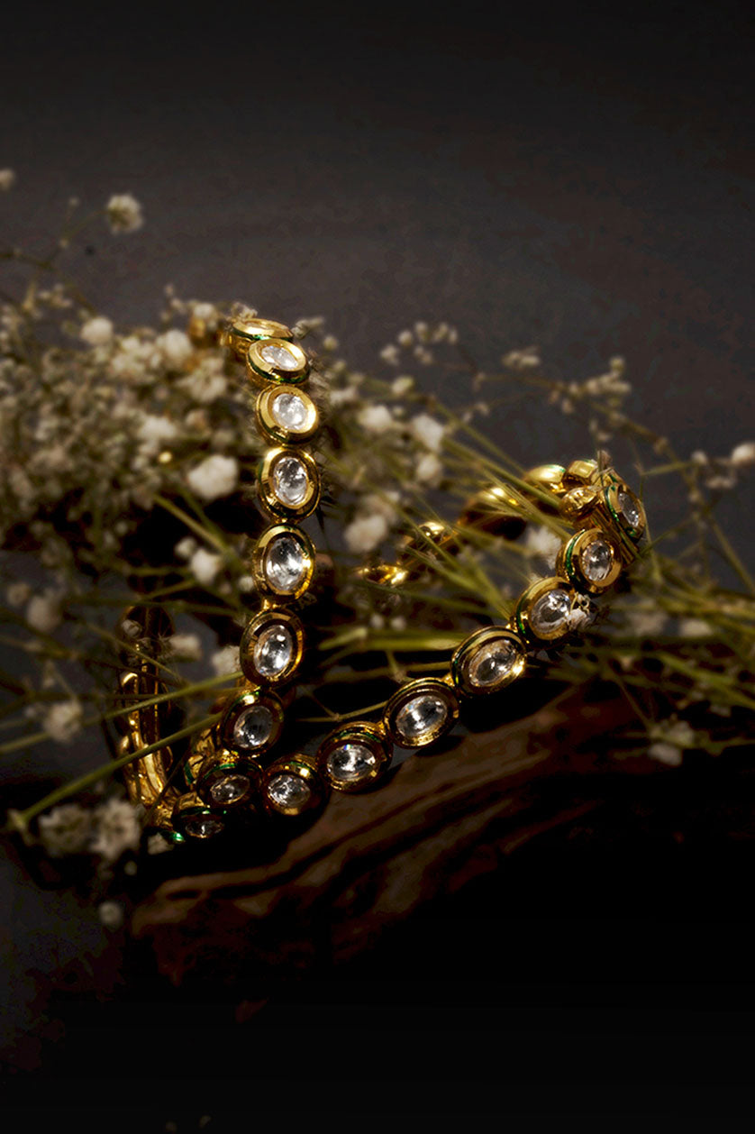 A closeup of single-line round-shaped vilandi bangles from BenzerWorld ethnicwear store.