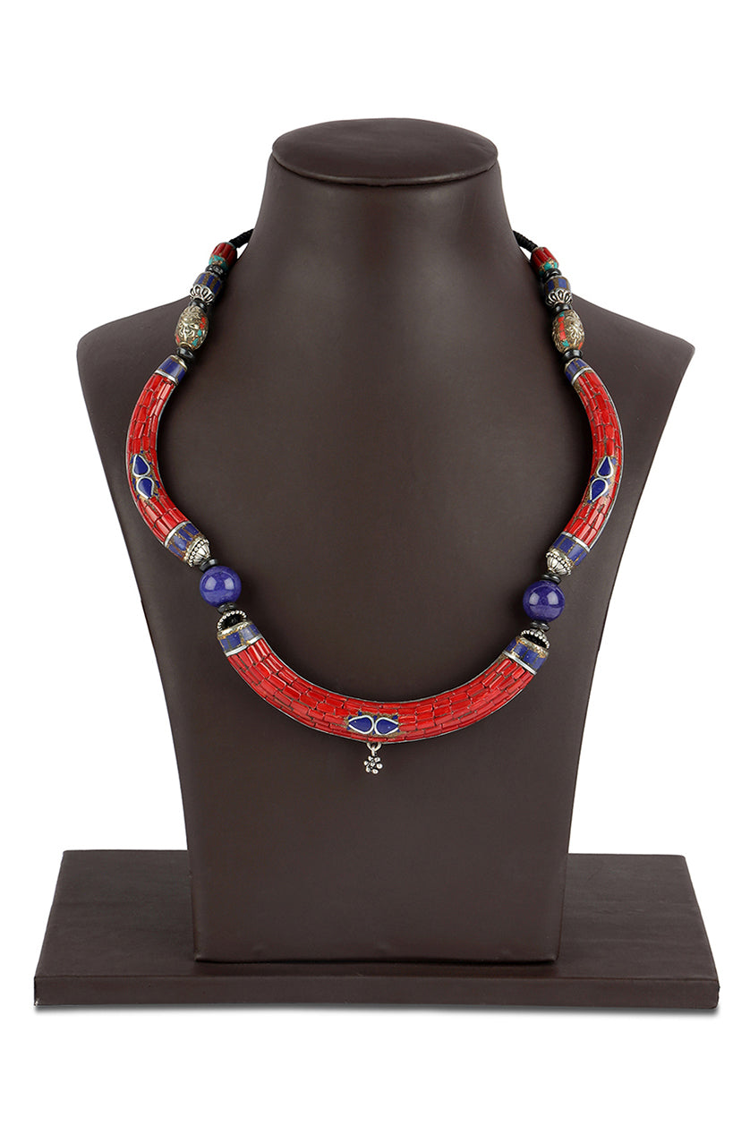 A closeup of tribal necklace with blue lapis stones from BenzerWorld ethnicwear store.