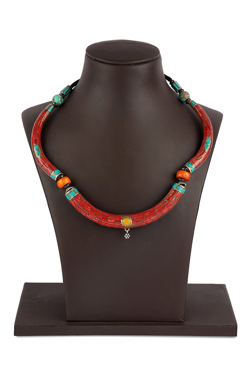 A closeup of a tribal red stiff necklace from BenzerWorld ethnicwear store.